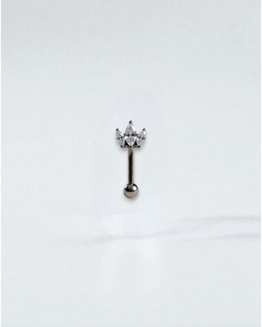 Odonata Banana Corona Marquise belly button ring with three marquise-cut white cubic zirconia stones and a titanium post.