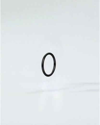 Odonata black stainless steel clicker hoop earring with gold plating, 8mm inner diameter.