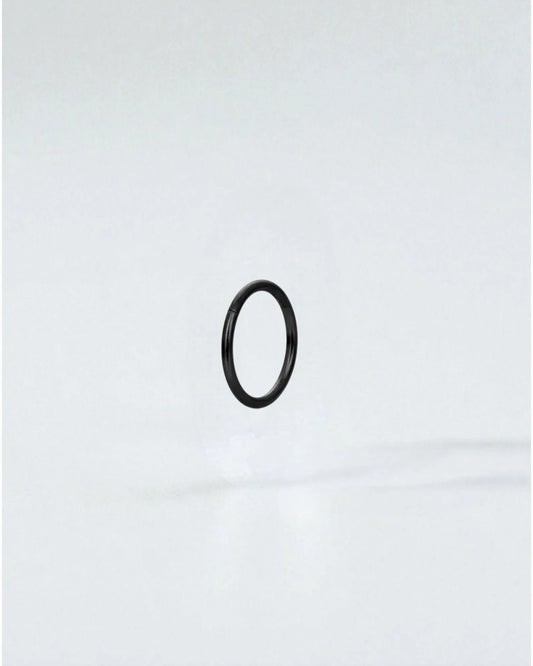 Odonata black stainless steel clicker hoop earring with gold plating, 8mm inner diameter.