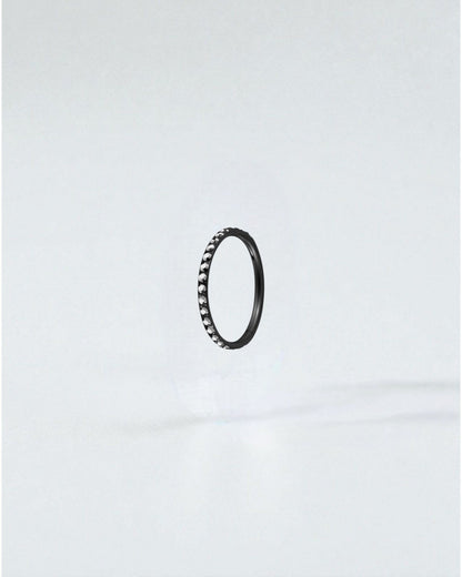 Odonata black titanium clicker hoop earring with clear crystals, 8mm diameter, 18g gauge.