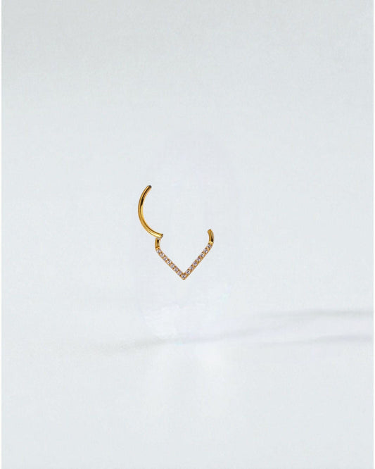 Odonata gold and silver clicker earrings with V-shaped design and white cubic zirconia stones, 8mm diameter.