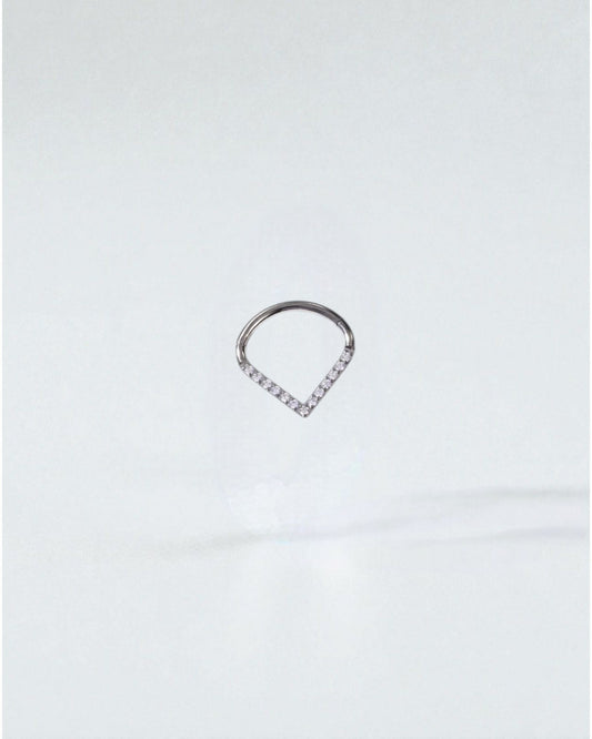 Odonata titanium clicker earring with white cubic zirconia in a drop shape, 10mm inner diameter.