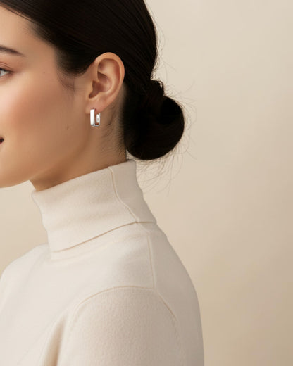 Odonata minimalist geometric semi-square huggie earrings in sterling silver with 18k gold plating.