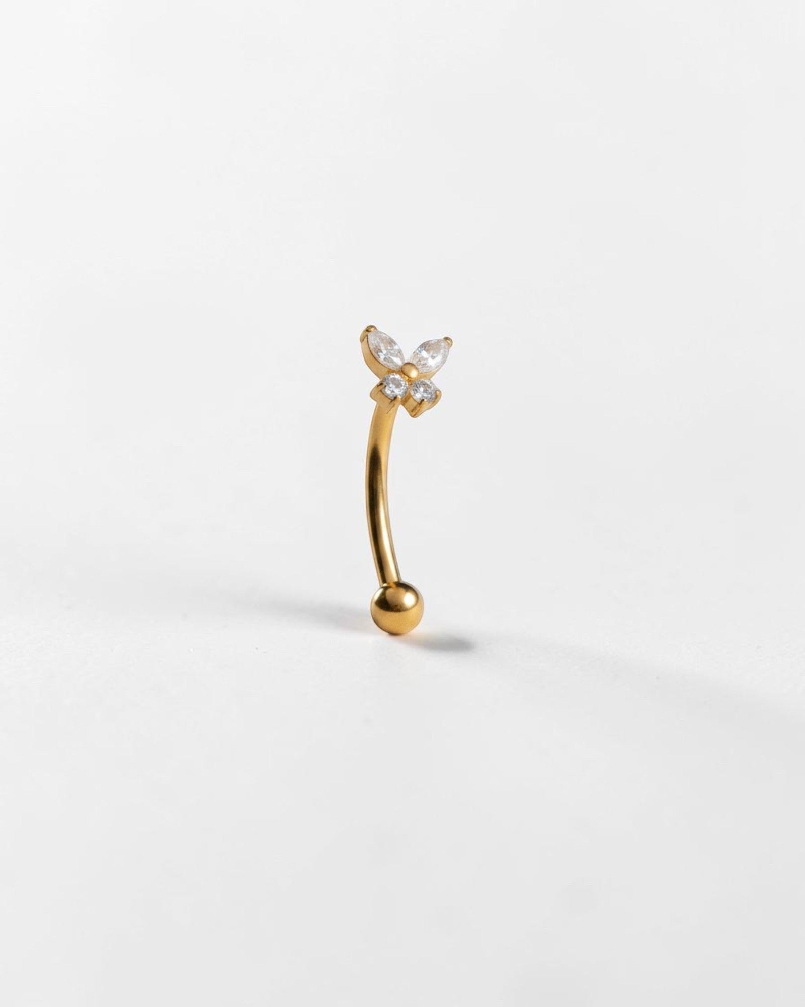 Odonata gold titanium banana barbell with butterfly design and white cubic zirconia stones, 16g.