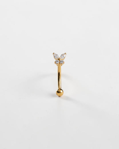 Odonata gold titanium eyebrow ring with butterfly design featuring clear cubic zirconia. Internal thread closure.