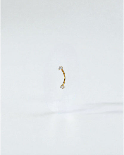 Odonata gold titanium curved barbell with white cubic zirconia ends, 6mm length, 16g.