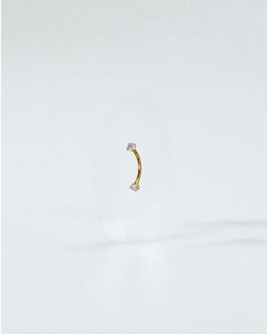Odonata gold titanium curved barbell with white cubic zirconia ends, 6mm length, 16g.
