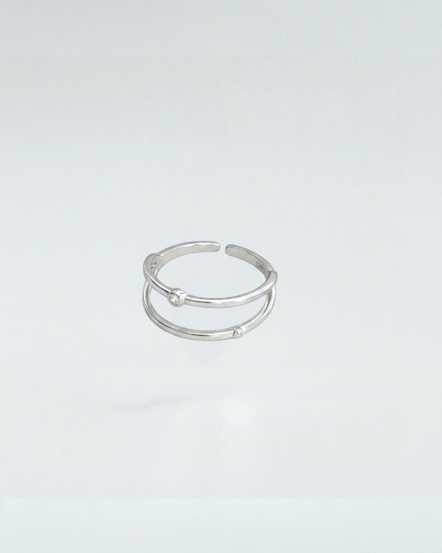 Odonata gold-plated sterling silver open ring with double geometric lines and cubic zirconia accents. Adjustable.