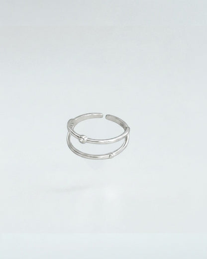 Odonata gold-plated sterling silver open ring with double geometric lines and cubic zirconia accents. Adjustable.