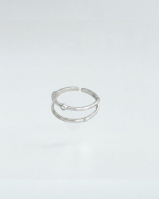 Odonata gold-plated sterling silver open ring with double geometric lines and cubic zirconia accents. Adjustable.