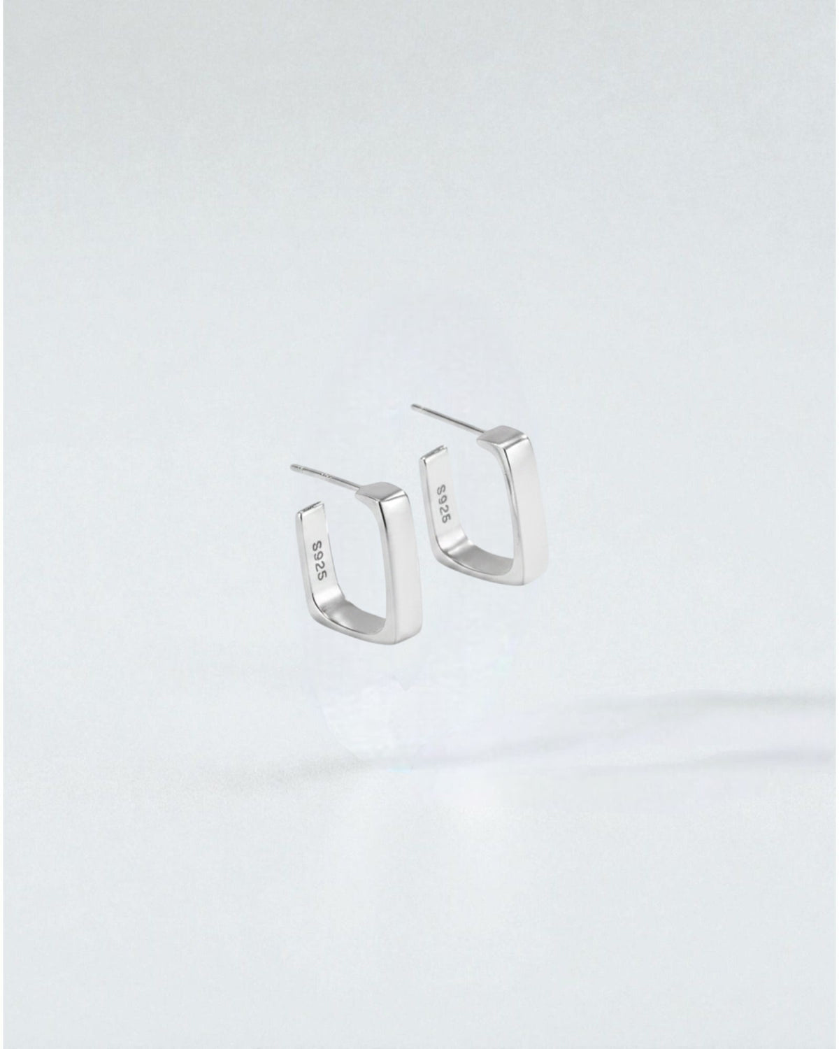 Odonata gold-plated sterling silver geometric semi-square huggie earrings, minimalist and elegant for daily wear.