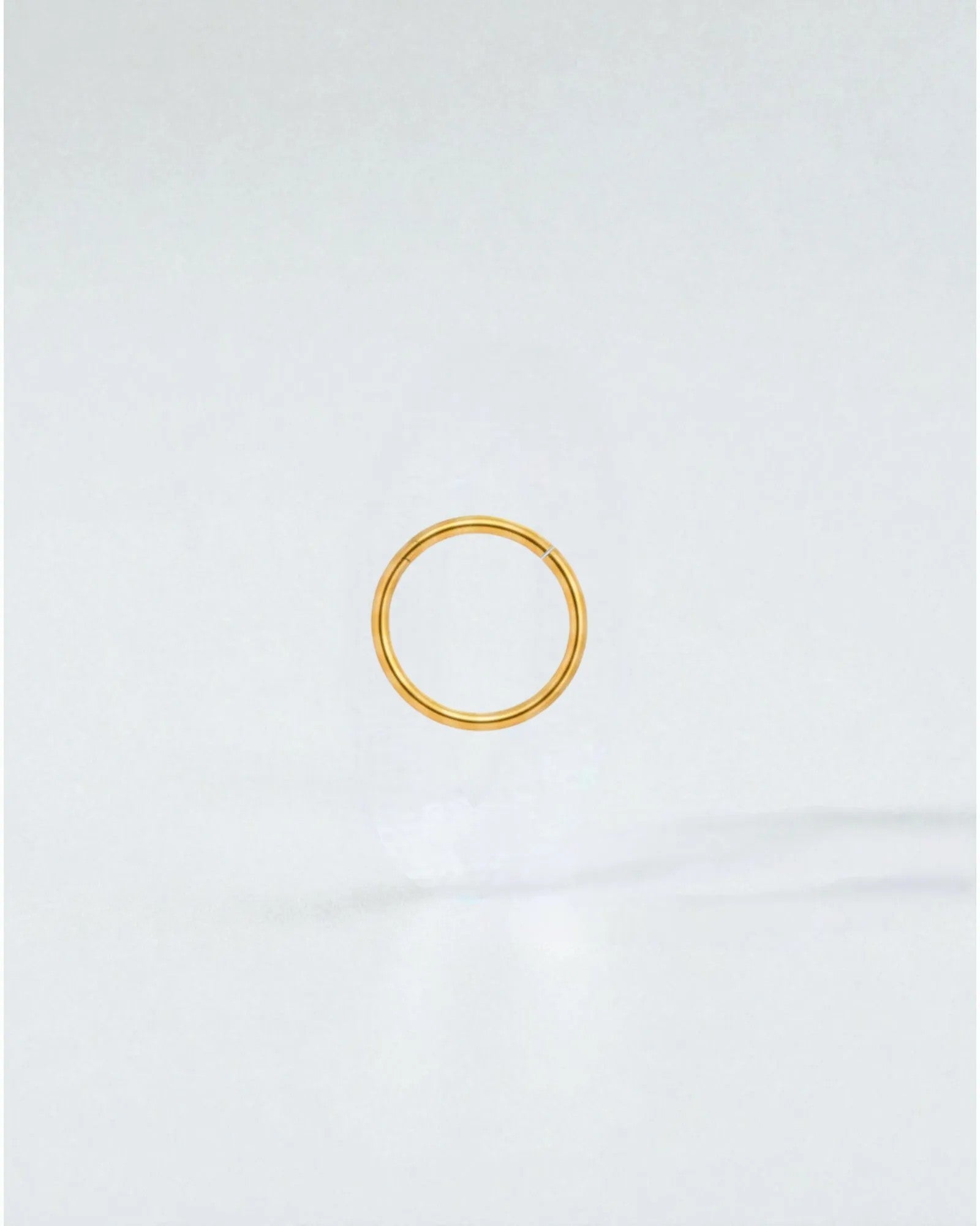 Odonata gold-plated stainless steel 8mm clicker hoop earring with a clean, minimalist design for everyday wear.
