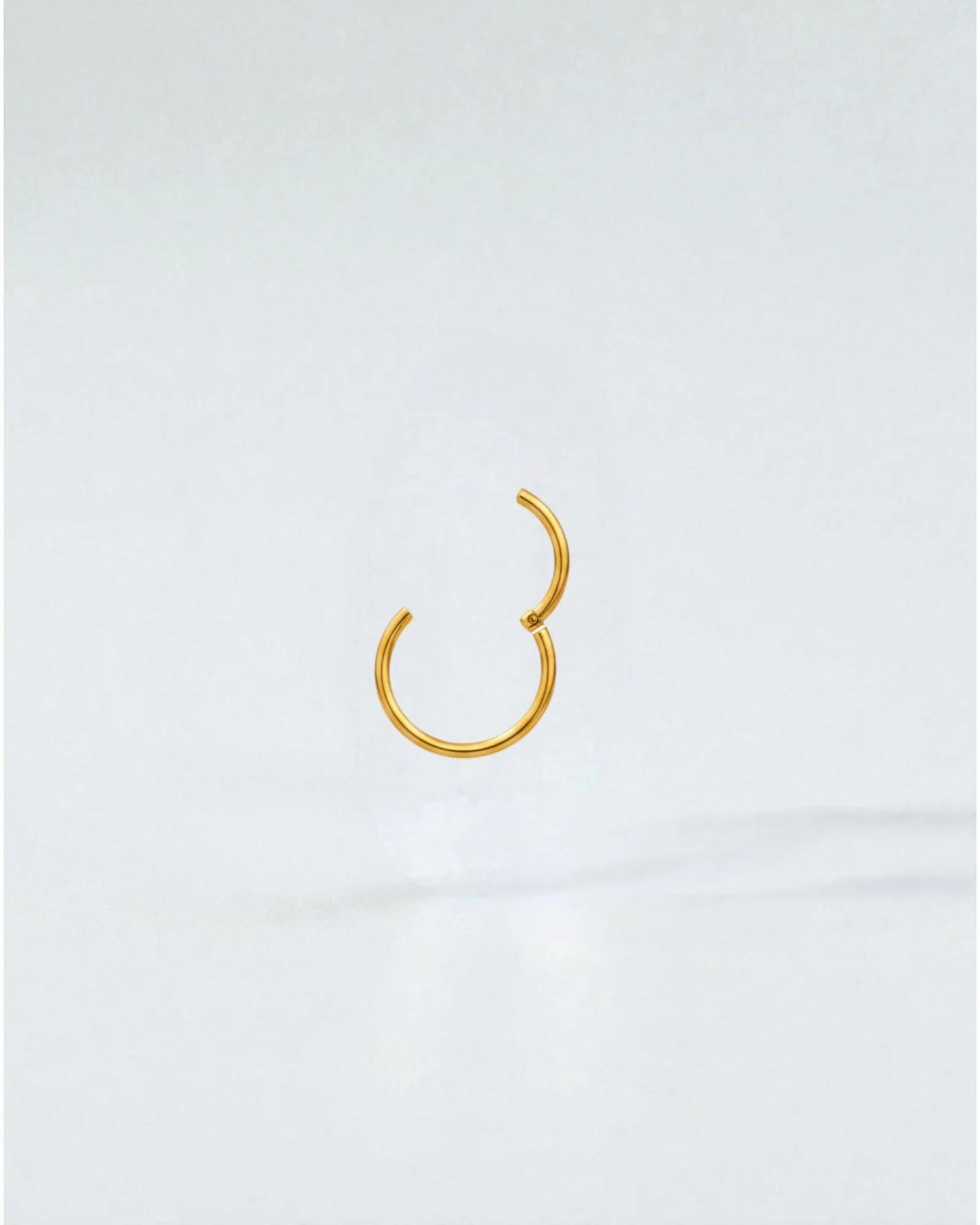 Odonata gold-plated stainless steel 8mm clicker hoop earring with a clean, minimalist design.