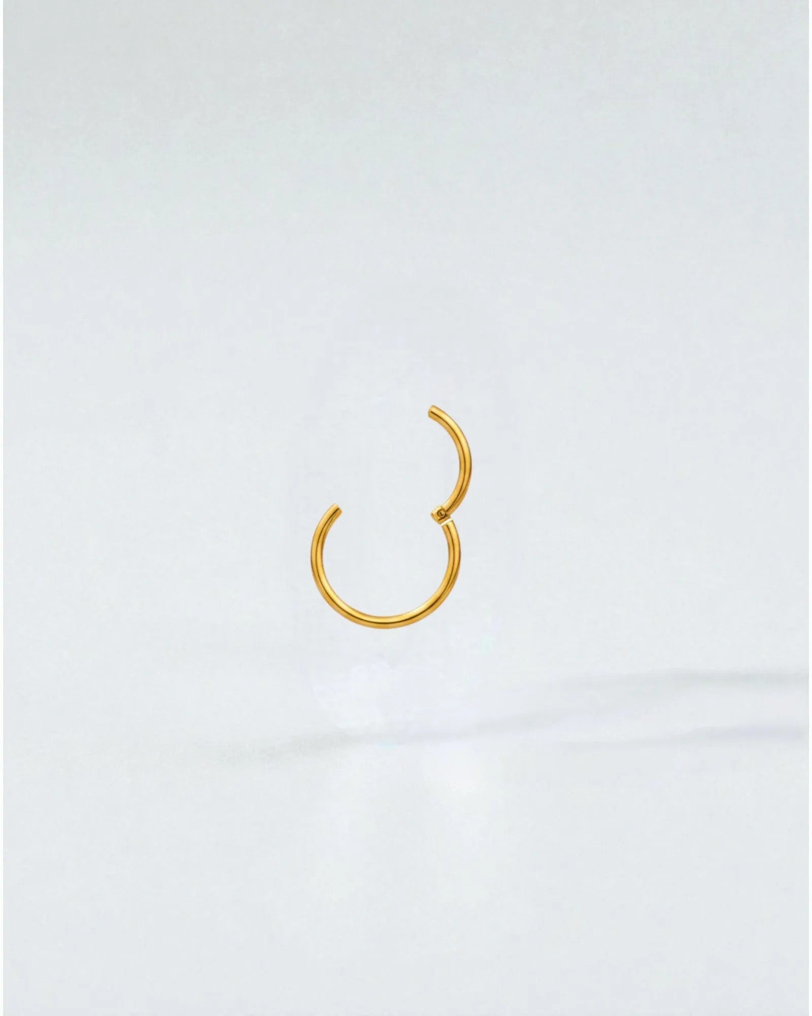 Odonata gold-plated stainless steel 8mm clicker hoop earring with a clean, minimalist design.