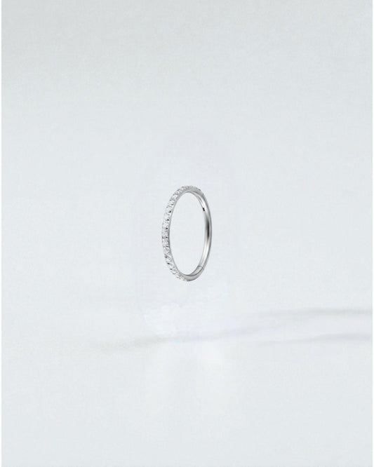 Odonata gold titanium clicker hoop earring with clear cubic zirconia gems, 6mm diameter.