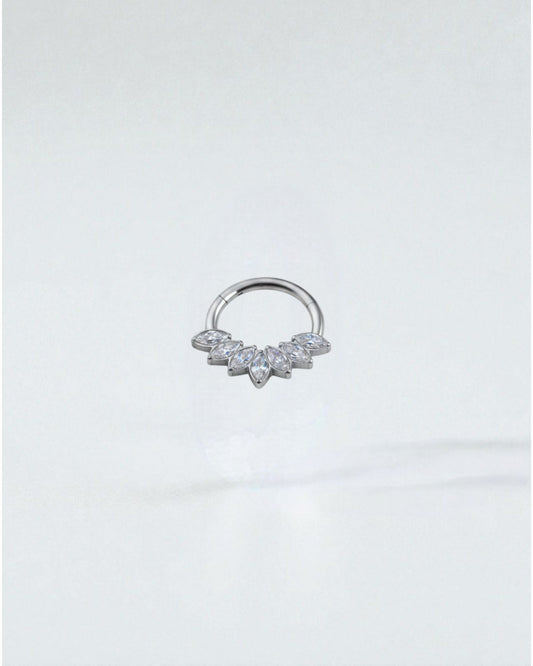Odonata gold titanium clicker septum or daith piercing with marquise-cut clear cubic zirconia stones arranged in a fan shape.