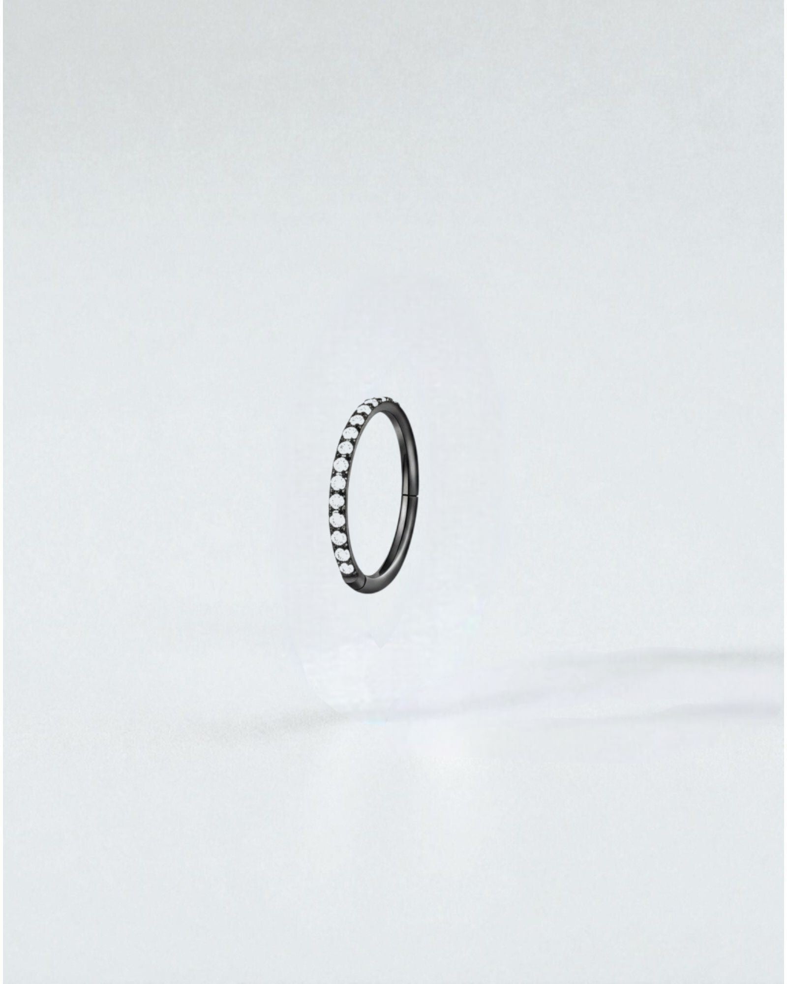 Odonata silver clicker hoop earring with pave set clear crystals, 8mm diameter, implant grade titanium.