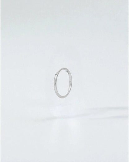Odonata silver-tone stainless steel 8mm clicker hoop earring with a clean, minimalist design.