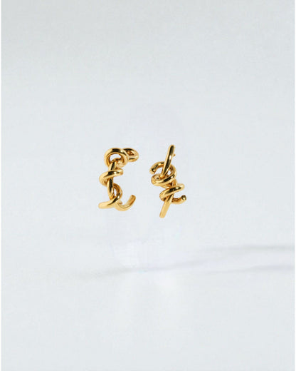 Odonata silver-tone brass twist earrings with 24k gold plating. Modern, sculptural design.