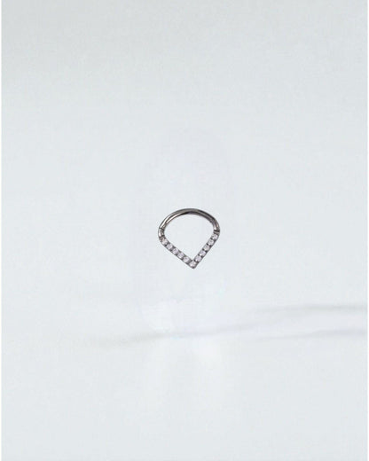 Odonata titanium clicker earring with white cubic zirconia in a V-shape, 8mm diameter, ideal for septum or daith piercings.