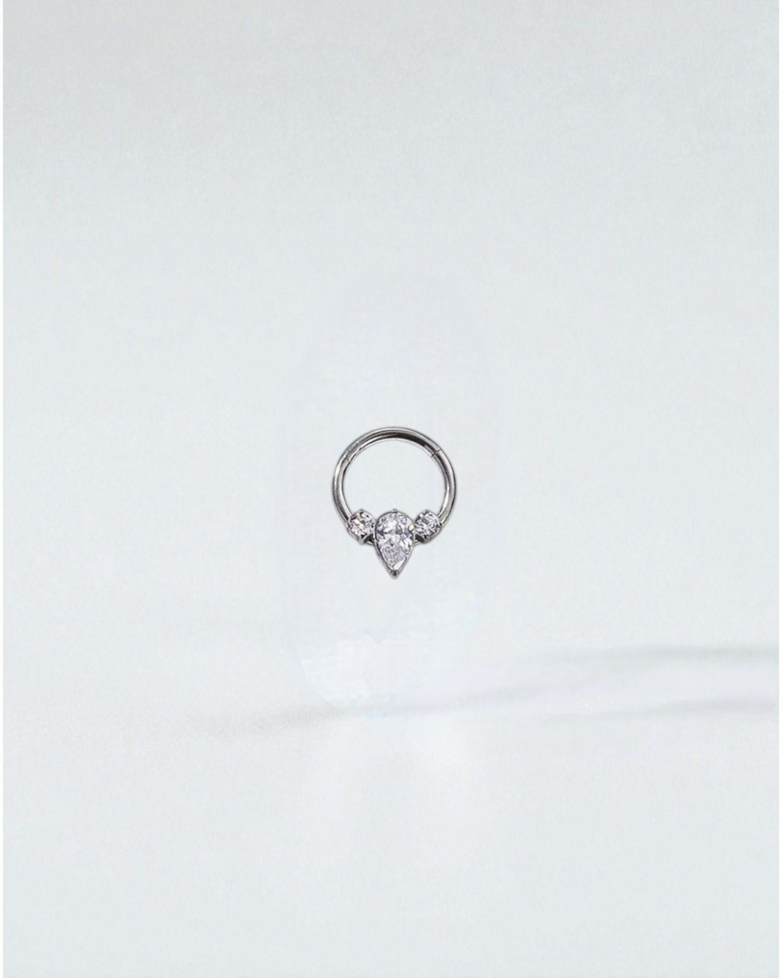 Odonata Clicker Diamante Triple implant-grade titanium septum rings with clear cubic zirconia gems in various designs.