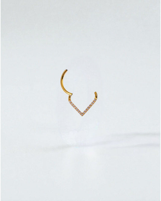 Odonata gold and silver clicker piercing with V-shaped design and white cubic zirconia stones.