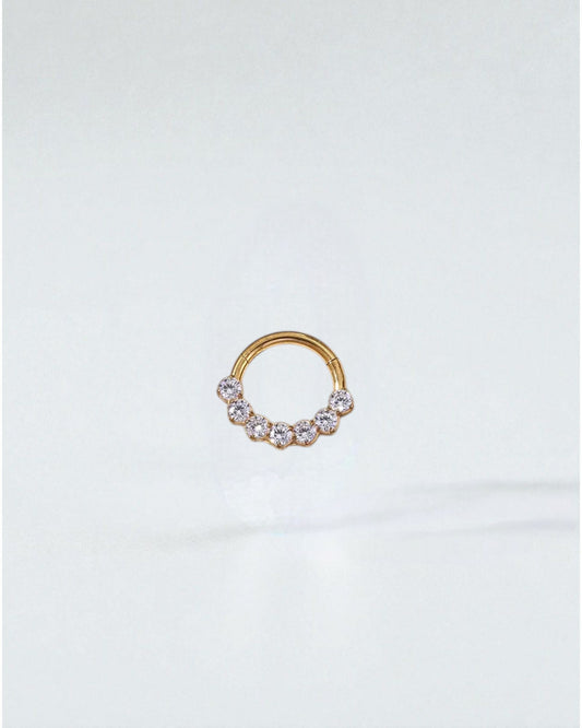 Odonata gold and silver clicker hoop earrings with 7 zirconias, 8mm, 16G, made of implant-grade titanium.